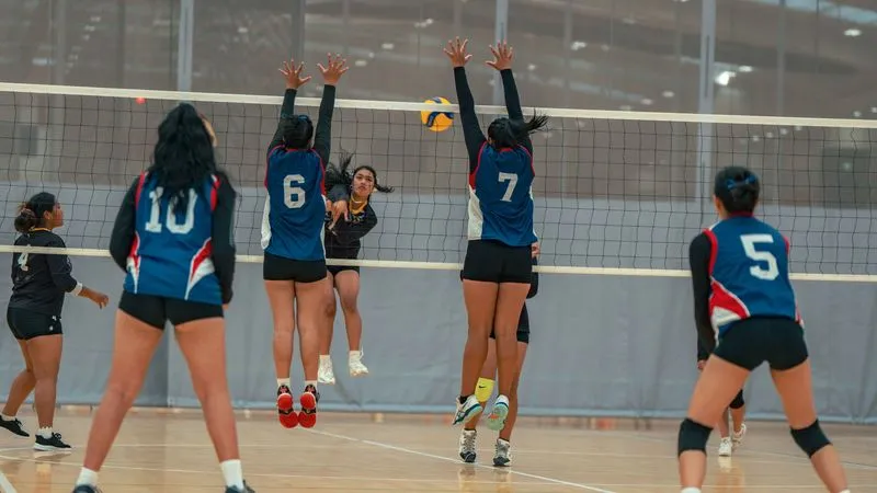 Rosehill College volleyball players mid-match