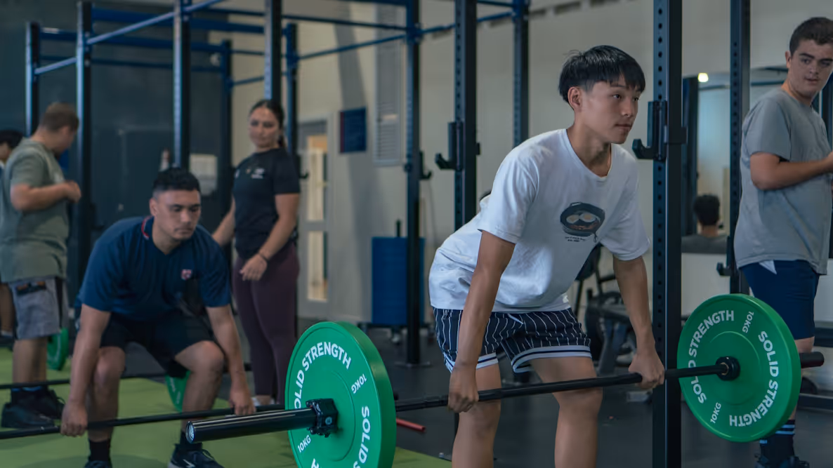 A Rosehill College student weightlifting