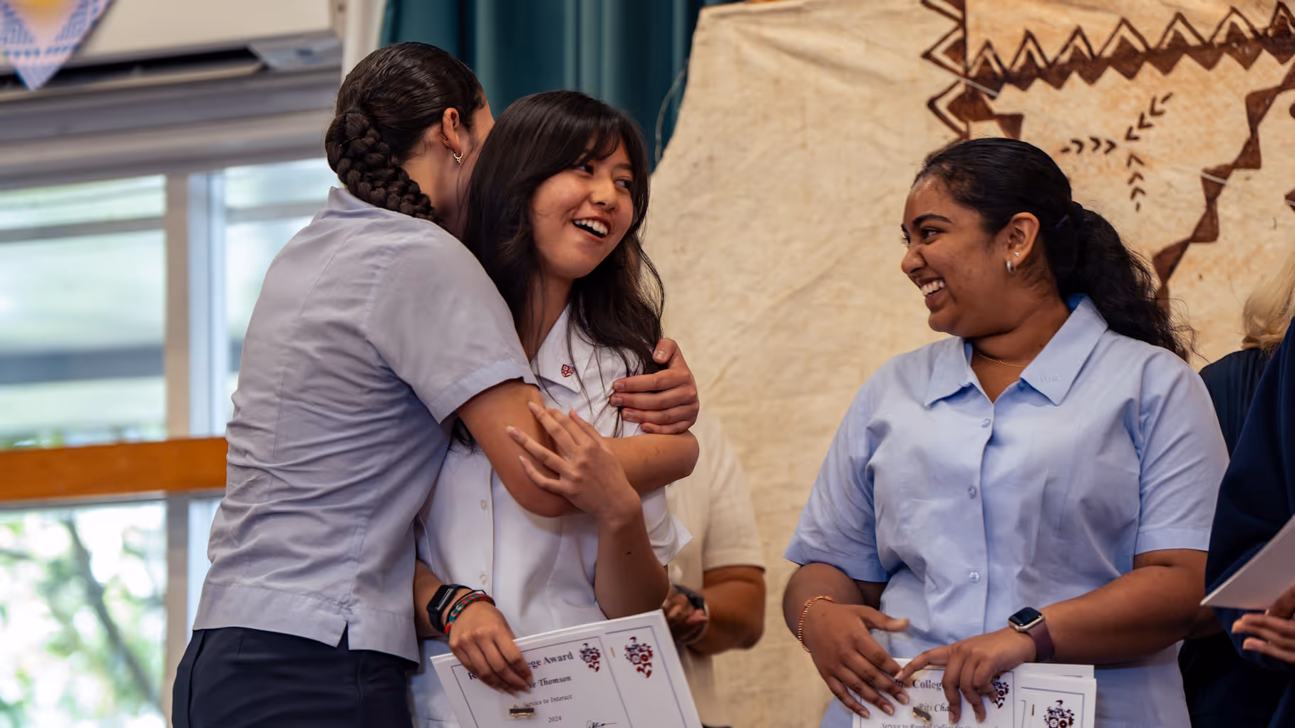 Rosehill College students celebrating success together with a certificate